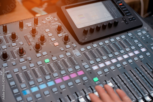 the mixer. remote for sound recording. sound engineer at work in the studio. sound amplifier mixing console equalizer. DJ