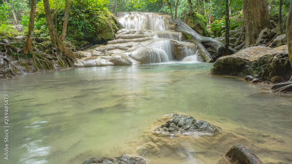 Naklejka premium Waterfall in rain forest at Erawan National Park at Kanchanaburi in Thailand