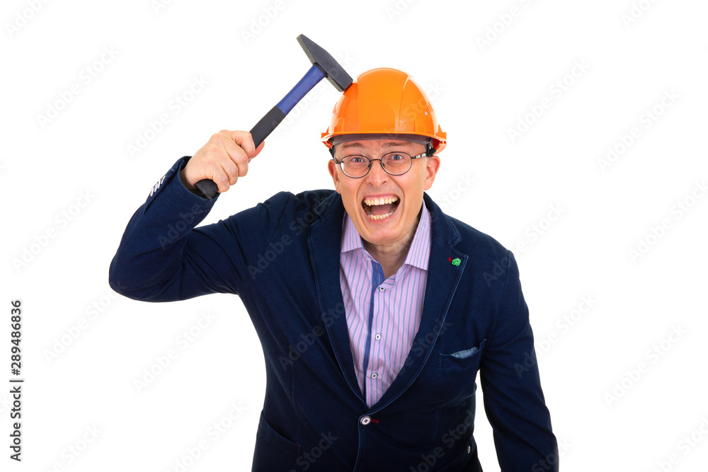 a man in a construction orange helmet tests the strength of the helmet with a hammer