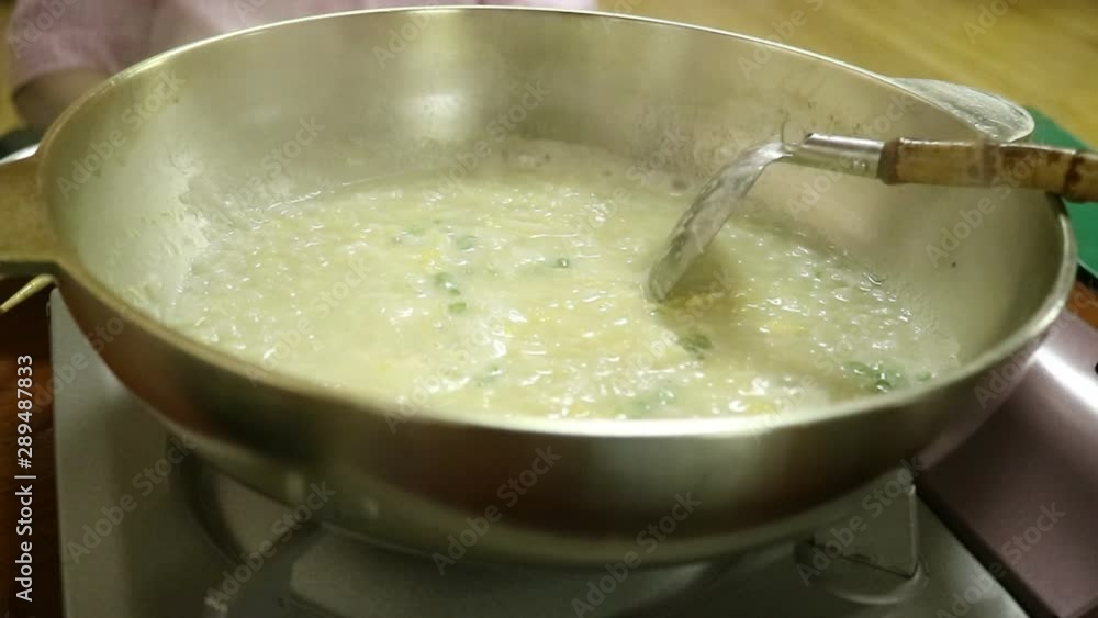 Cooking sukiyaki in hot pot at Japanese restaurant Cooking sukiyaki in hot pot at Japanese restaurant