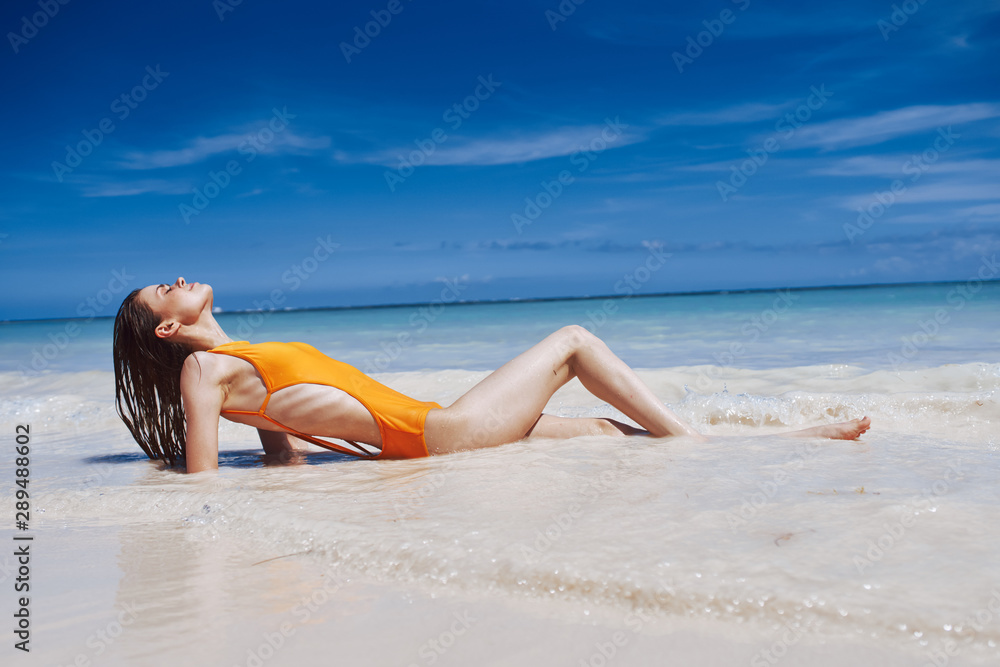 Naklejka premium woman in bikini on beach