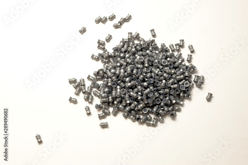 Airgun pellets made of led on white background.