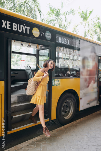 Passengers leave the city bus photo