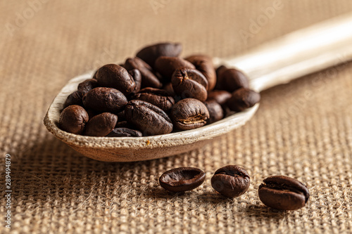 coffee beans in a spoon (ID: 289494879)