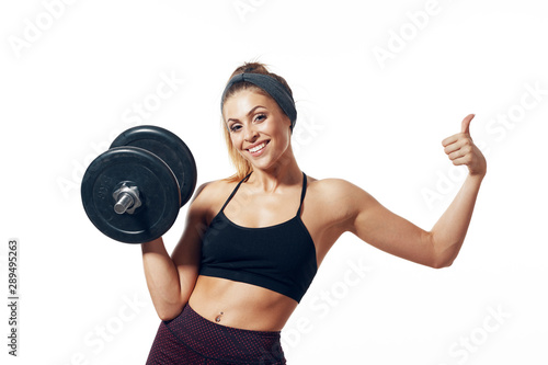 young woman with dumbbells