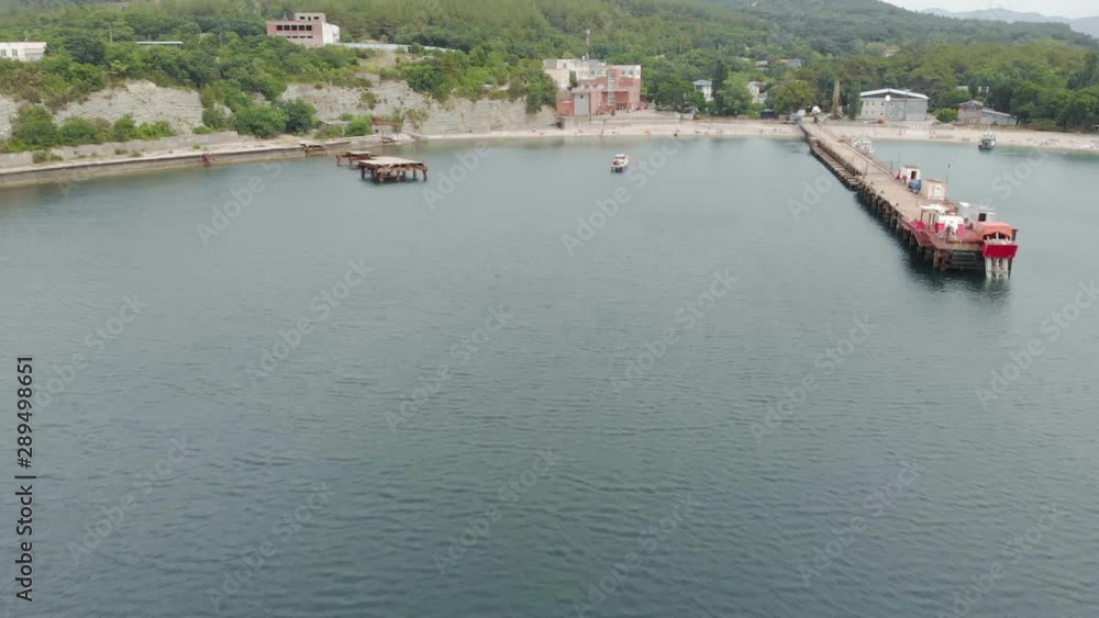 Flying over the pier to the sea. Aerial shot Flying over the pier to the sea. Aerial shot
