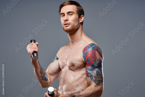young man with dumbbells