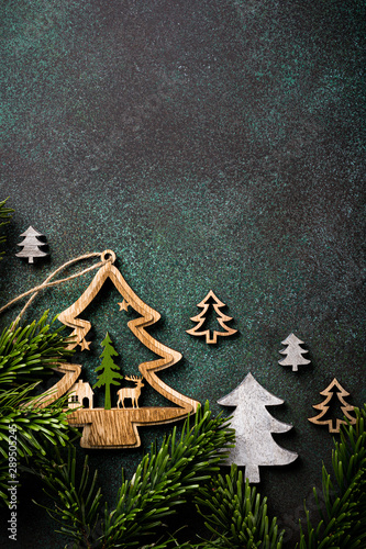 Overhead shoot of wooden christmas tree and decoration. Winter holidays background with copy space, flat lay, top view.