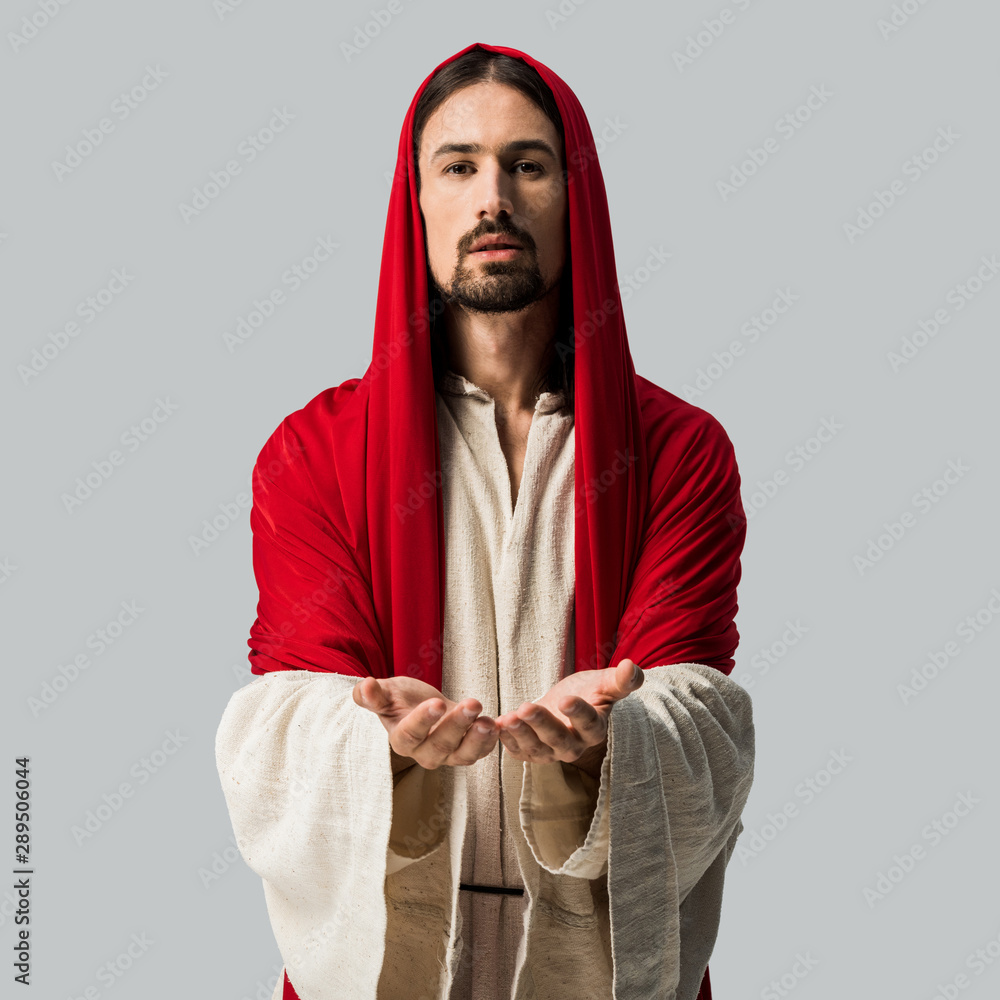 religious man standing with cupped hands and looking at camera isolated on grey religious man standing with cupped hands and looking at camera isolated on grey