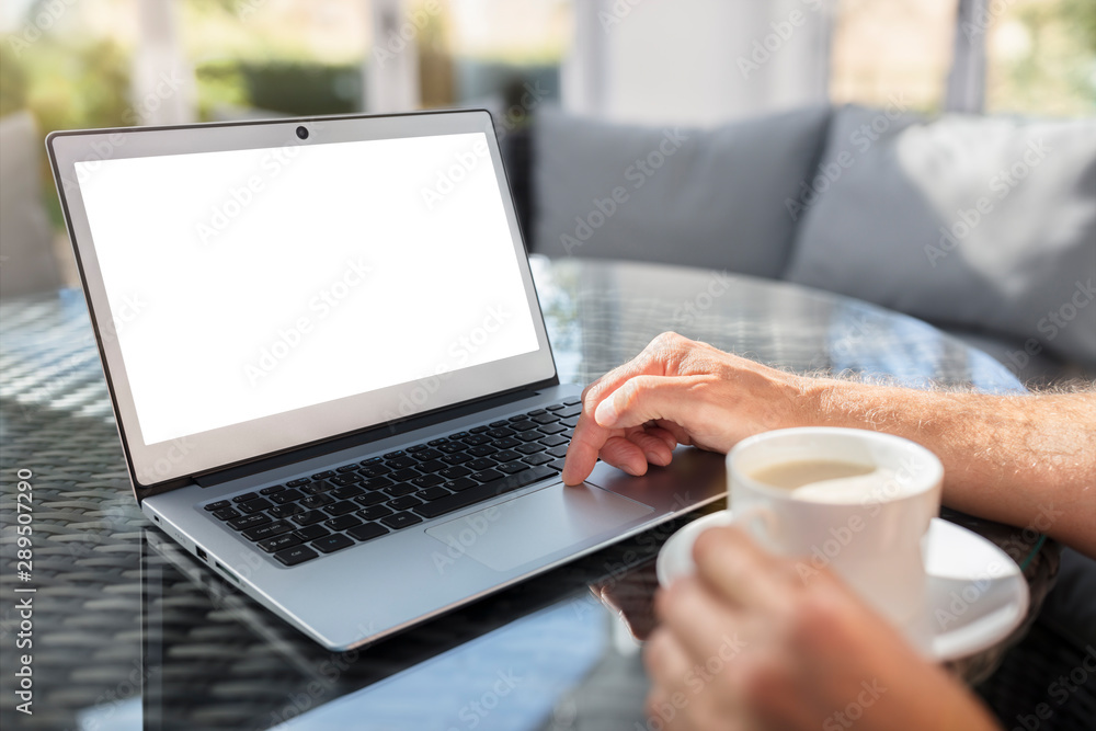 Laptop computer on desk working in cafe or office with blank screen Laptop computer on desk working in cafe or office with blank screen