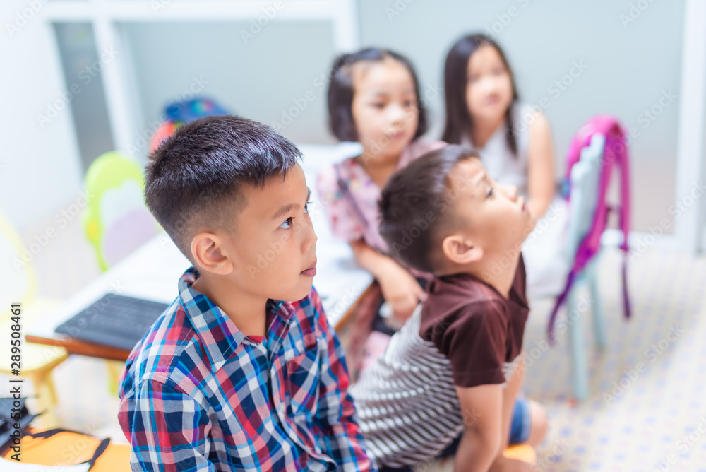 Asian elementary school children are studying and having fun in the classroom. Asian elementary school children are studying and having fun in the classroom.