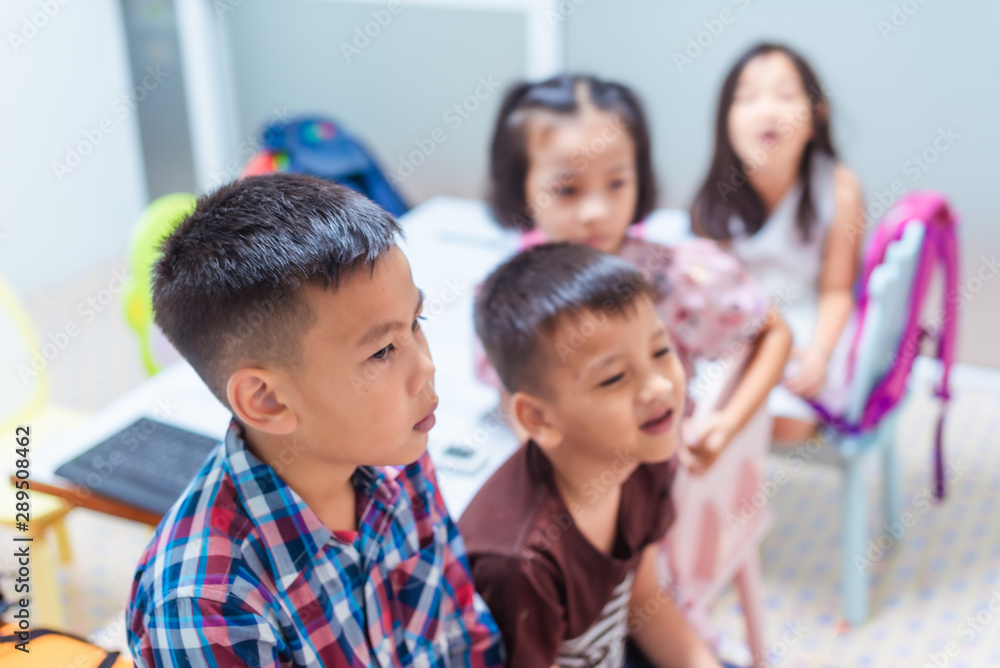 Asian elementary school children are studying and having fun in the classroom. Asian elementary school children are studying and having fun in the classroom.