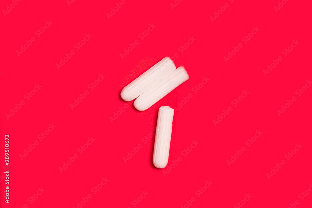 hygienic tampons on a red background, womens health hygienic tampons on a red background, womens health