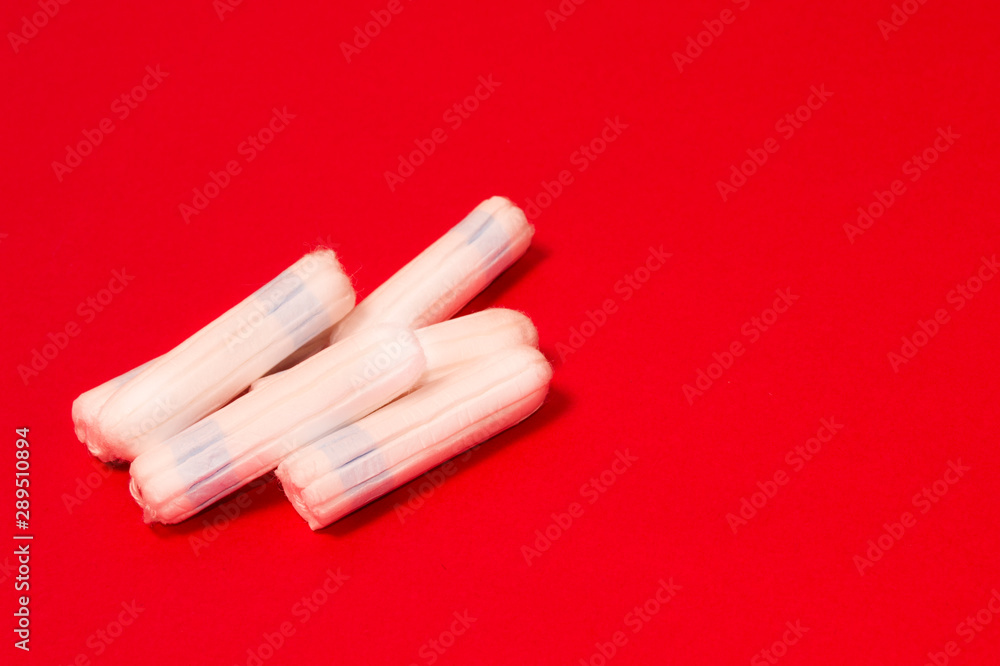 hygienic tampons on a red background, womens health hygienic tampons on a red background, womens health