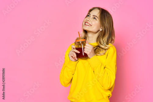 Cheerful woman with a cocktail