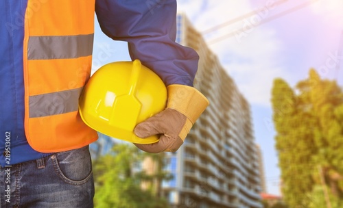 Man and helmet in hand