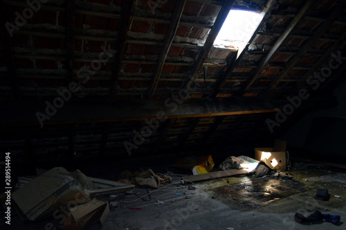 Dark and scary attic in an abandoned house