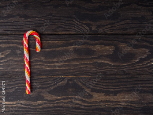 Christmas Cane On Wooden Background, Happy new year background, Composition of the Christmas decorations.