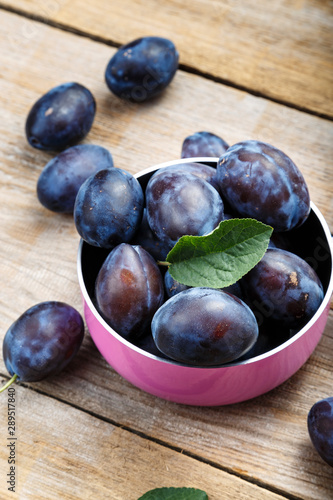 ripe plums in a bowl