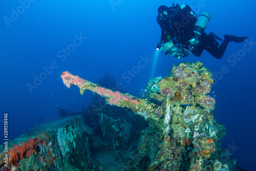 scuba diver and WWII shipwreck