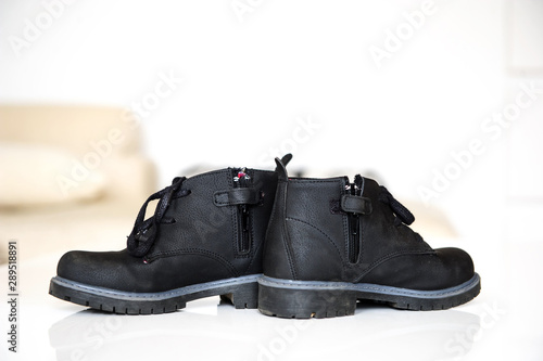  closeup black autumn boots with laces for boys