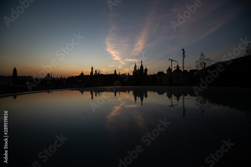 Kremlin silhouette view at sunset in Moscow, Russia. Dormition orthodox cathedral in the middle with other bell towers and towers on the sides. Architecture and travel concepts