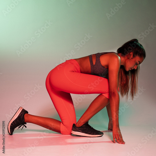 Side view of athlete in crouching start