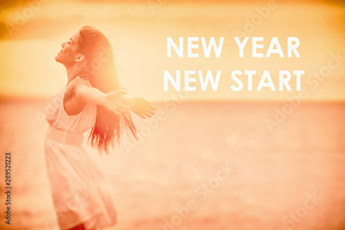 New Year Resolution woman feeling happy emotion free in sunset freedom with text NEW YEAR NEW START on copy space nature beach background.