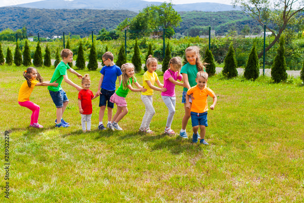 Obraz premium Kids have fun outdoors, friendship and teamwork concept