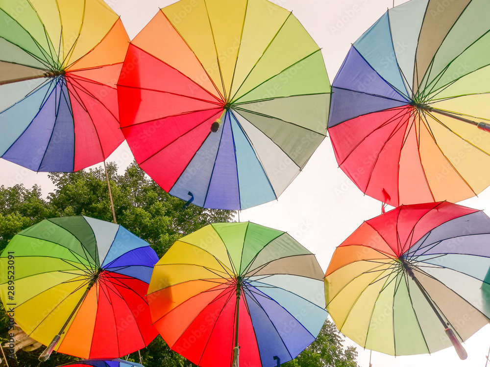 many colorful umbrella in the air