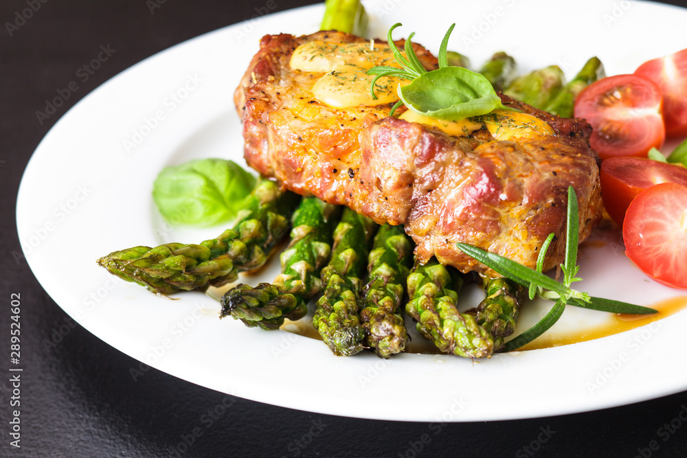 Gourmet steak with green asparagus on the plate Gourmet steak with green asparagus on the plate