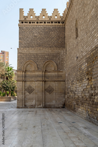 Outer wall of public historic Al Hakim Mosque known as The Enlightened Mosque, located in Moez Street, Old Cairo, Egypt photo