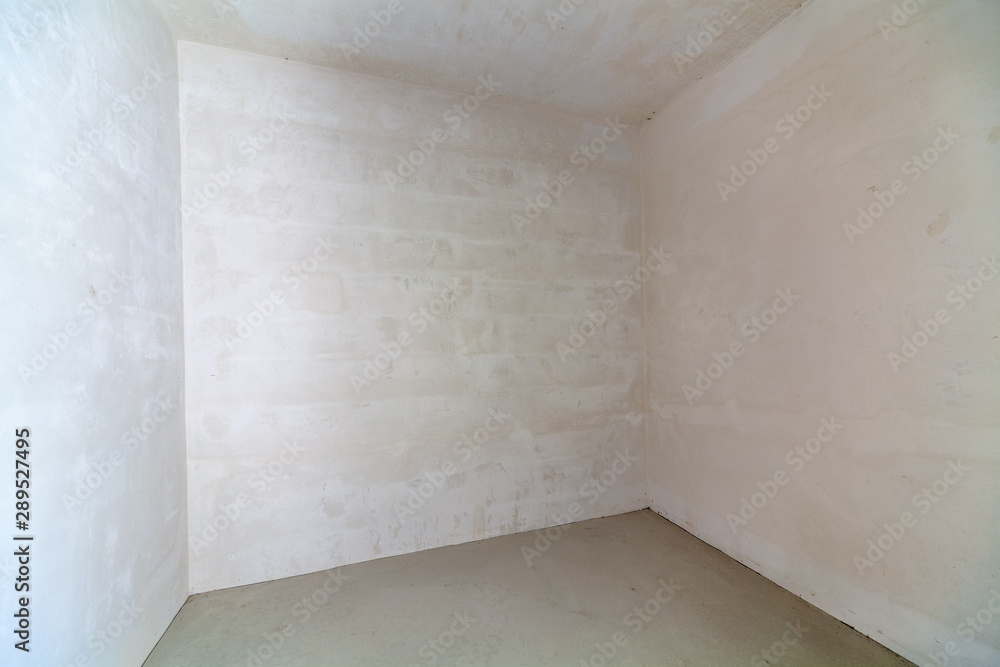 Empty unfinished room. Unfinished building interior white room