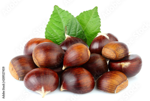Chestnuts with chestnut leafs isolated. photo