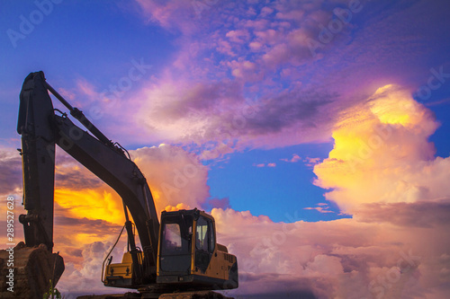 excavator at sunset