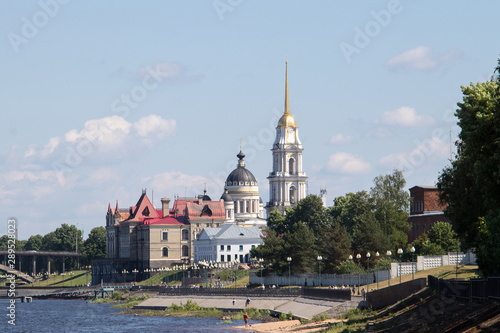 Rybinsk. View of the building of the grain exchange, the Holy Transfiguration Cathedral and the bridge over the Volga river. View from the river
