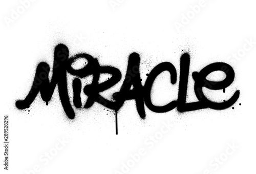 graffiti miracle word sprayed in black over white