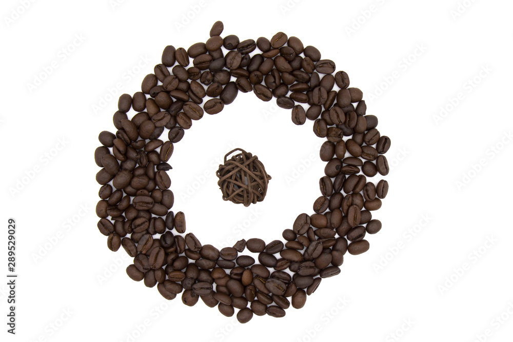 pieces of chocolate on a white background, and around the roasted coffee beans pieces of chocolate on a white background, and around the roasted coffee beans