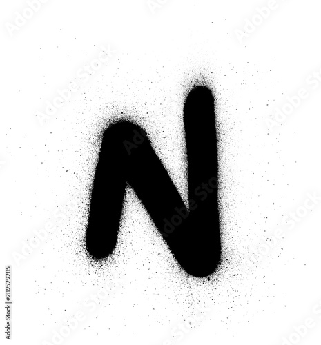 graffiti small fat N font sprayed in black over white