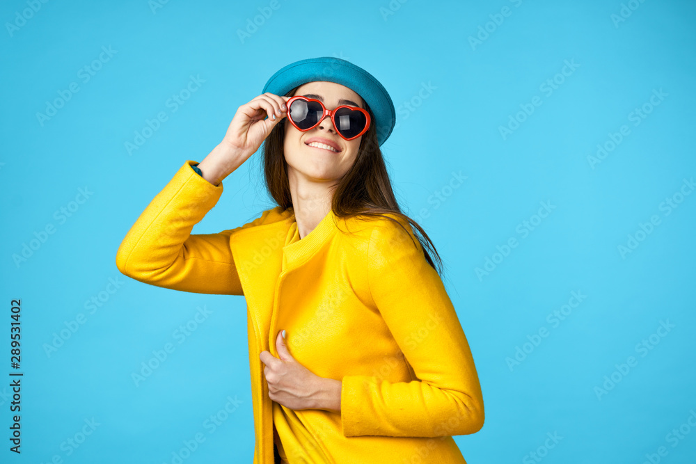 young woman in a hat and sunglasses young woman in a hat and sunglasses