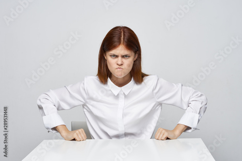 portrait of young woman sitting on sofa