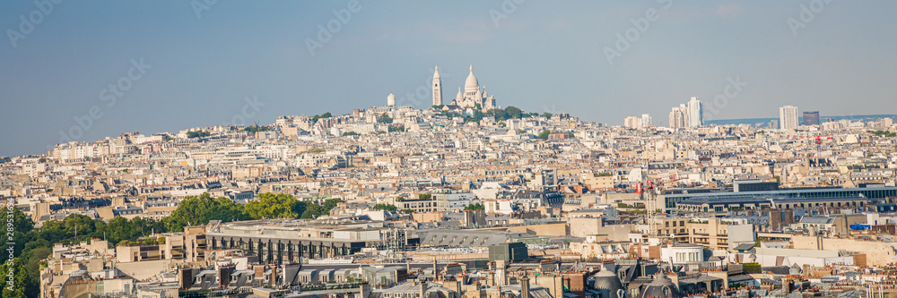 Paris skyline and panorama with the hill of Montmartre and the Sacred-Heart seen from the roof of the Arc de Triomphe