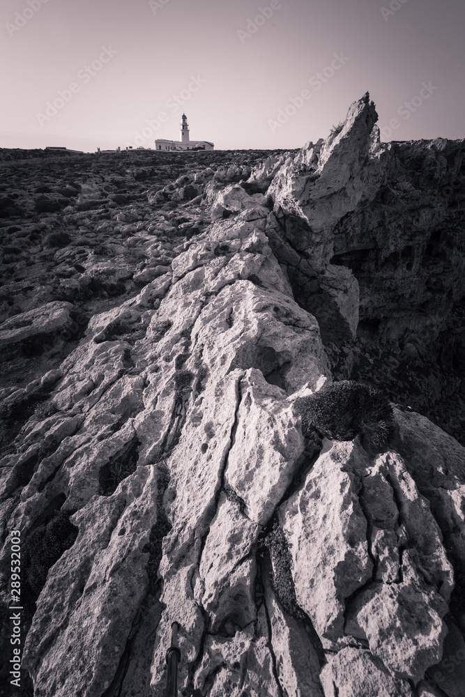 Fototapeta premium Cavalleria lighthouse at the north cap from Menorca island, Spain.