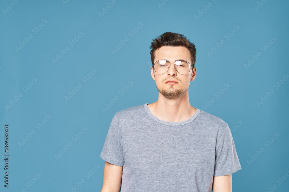 portrait of young man with arms crossed portrait of young man with arms crossed