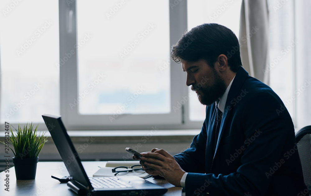 businessman working on laptop in office businessman working on laptop in office