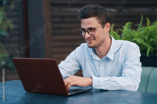 young man working on his laptop at home