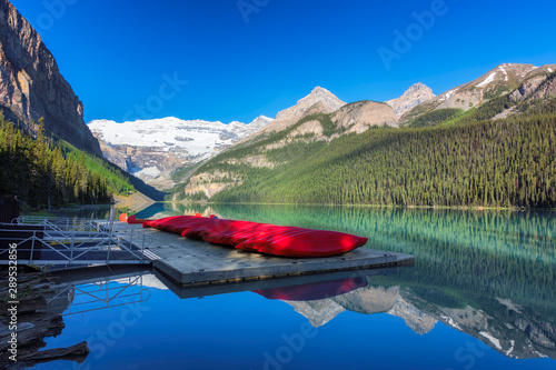 Beautiful sunrise under turquoise waters of the Lake Louise in Canadian Rockies, Banff National Park, Canada