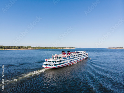 A cruise ship with tourists passes along the Volga downstream towards Astrakhan. Volgograd. Russia