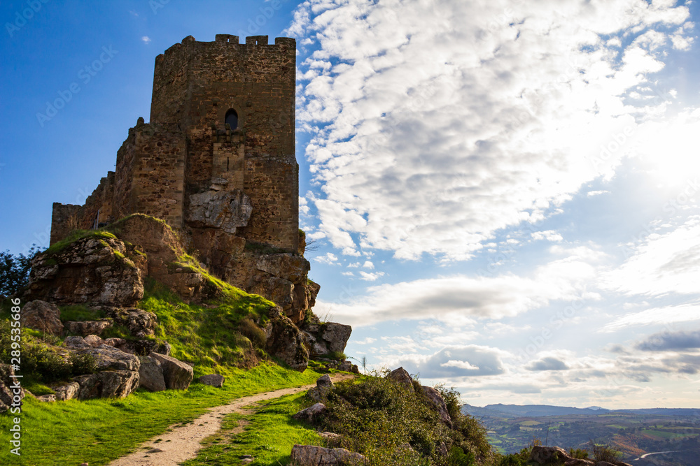 Algoso Castle, as if dividing the clouds in the sky, and the horizon in the distance