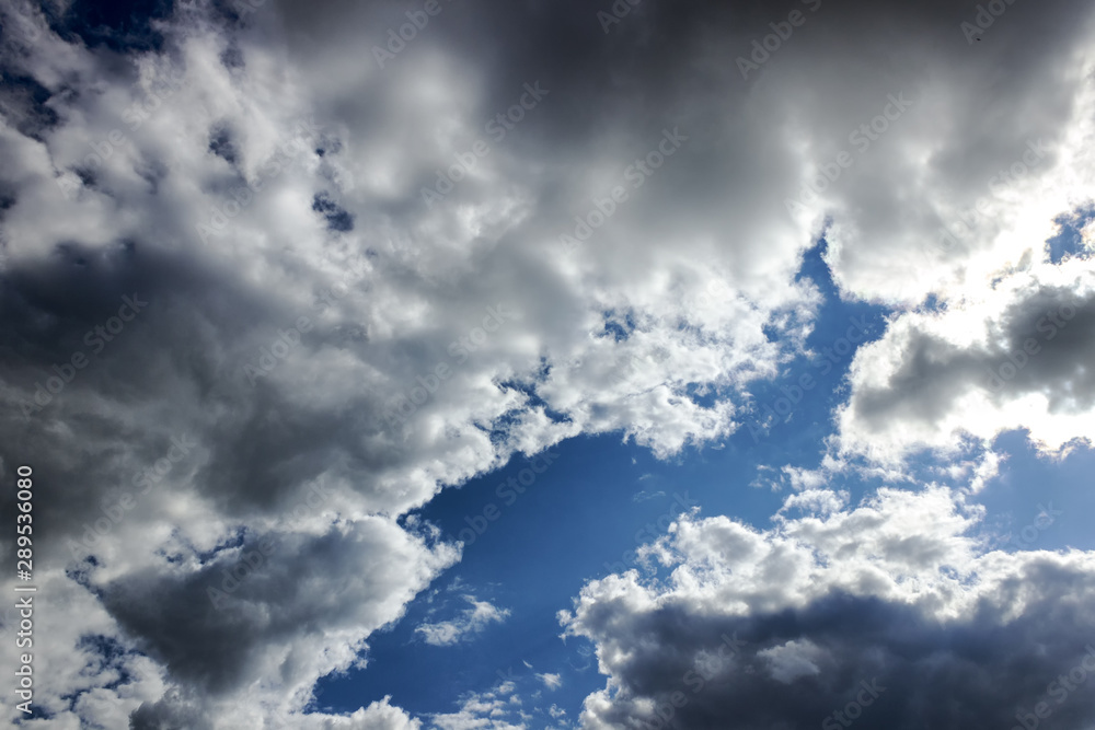 Fototapeta premium in the blue sky clouds and the sun.